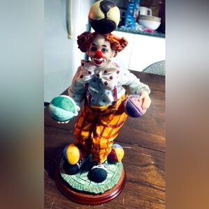 Ceramic clown figurine balances 5 balls